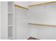 Organized walk-in closet with shelving and hanging rods for efficient storage at 2625 E Beverly Rd, Phoenix, AZ 85042