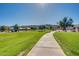 Scenic community path with lush green landscaping and mountain views creates a tranquil neighborhood atmosphere at 2625 E Beverly Rd, Phoenix, AZ 85042
