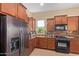 Gourmet kitchen featuring granite countertops, tiled backsplash, stainless steel appliances, and abundant cabinet space at 29159 N 128Th Ln, Peoria, AZ 85383