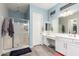 Bathroom featuring glass shower, white vanity, and tile flooring at 3081 E Desert Broom Pl, Chandler, AZ 85286
