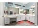 Bathroom with white cabinets, vanity, and wood-look tile floor at 3081 E Desert Broom Pl, Chandler, AZ 85286