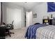 Bedroom with carpet, closet, bed, and desk with chair with cool colors at 3081 E Desert Broom Pl, Chandler, AZ 85286