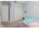 Bedroom with bed, desk, chair, and sliding closet doors at 3081 E Desert Broom Pl, Chandler, AZ 85286