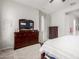 Bedroom featuring wood dresser, carpet, and closet access at 3081 E Desert Broom Pl, Chandler, AZ 85286