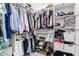 Walk-in closet with racks for clothing and storage for shoes and accessories at 3081 E Desert Broom Pl, Chandler, AZ 85286