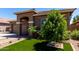 View of a landscaped front yard featuring vibrant artificial turf and desert landscaping for low maintenance at 3081 E Desert Broom Pl, Chandler, AZ 85286