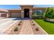 Charming single-story home featuring a low-maintenance front yard with vibrant artificial turf and desert landscaping at 3081 E Desert Broom Pl, Chandler, AZ 85286
