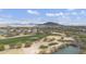 Expansive aerial view of golf course community featuring lush green fairways and mountain views at 33575 N Dove Lakes Dr # 2033, Cave Creek, AZ 85331