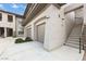 A condo with an attached garage and stairs leading to the second level at 33575 N Dove Lakes Dr # 2033, Cave Creek, AZ 85331