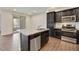 Modern kitchen with stainless steel appliances, granite counters, and an island sink at 33575 N Dove Lakes Dr # 2033, Cave Creek, AZ 85331