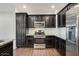 Stylish kitchen with stainless steel appliances, granite countertops, and dark wood cabinetry at 33575 N Dove Lakes Dr # 2033, Cave Creek, AZ 85331