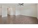 Open-concept living room with wood floors and neutral walls provides a versatile space at 33575 N Dove Lakes Dr # 2033, Cave Creek, AZ 85331