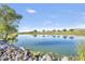 Scenic pond with blue water reflecting the sky and trees at a golf course community at 33575 N Dove Lakes Dr # 2033, Cave Creek, AZ 85331