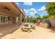 Comfortable back patio with BBQ grill and exterior dining area by the pool at 3514 E Desert Broom E Way, Phoenix, AZ 85044