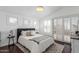 Bright bedroom with neutral walls, wood floors, plantation shutters and ample natural light, perfect for relaxation at 3514 E Desert Broom E Way, Phoenix, AZ 85044