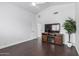 Minimalist room with wood floors, a cozy fireplace and entertainment center, providing a modern, comfortable atmosphere at 3514 E Desert Broom E Way, Phoenix, AZ 85044