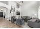 Spacious living room with a decorative fireplace, high ceilings and modern décor, ideal for relaxation and entertaining at 3514 E Desert Broom E Way, Phoenix, AZ 85044