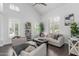 Bright living room with high ceilings, plantation shutters, and stylish furnishings, creating an inviting atmosphere at 3514 E Desert Broom E Way, Phoenix, AZ 85044