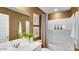 Modern bathroom features a vanity with ample counter space, modern fixtures, and framed artwork at 36620 W Maddaloni Ave, Maricopa, AZ 85138