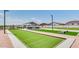Community bocce ball court for residents' enjoyment at 36620 W Maddaloni Ave, Maricopa, AZ 85138