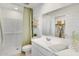 Bright bathroom featuring a walk-in shower, open shelving, and contemporary fixtures at 36620 W Maddaloni Ave, Maricopa, AZ 85138