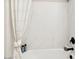 Modern bathroom with a white marble shower surround and black fixtures at 3913 S 233Rd Ln, Buckeye, AZ 85326