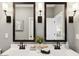 Chic bathroom with double vanity, sleek fixtures, and stylish sconces offering a modern aesthetic at 3913 S 233Rd Ln, Buckeye, AZ 85326