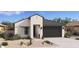 Beautiful single-story home featuring a modern design and a low-maintenance desert landscape at 3913 S 233Rd Ln, Buckeye, AZ 85326