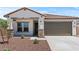 Beautiful single-Gathering home with a well-manicured front yard and a two-car garage at 3913 S 233Rd Ln, Buckeye, AZ 85326