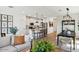 Open-concept living space with kitchen, dining, and living areas with lots of natural light at 3913 S 233Rd Ln, Buckeye, AZ 85326