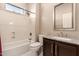 Bathroom featuring a shower-tub combo, dark wood vanity, and granite countertop at 41638 N Emerald Lake Dr, Anthem, AZ 85086