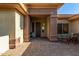 Inviting front entrance with a brick walkway, covered porch, and decorative columns at 41638 N Emerald Lake Dr, Anthem, AZ 85086