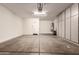 Spacious garage featuring ample storage cabinets and a clean, well-lit interior at 41638 N Emerald Lake Dr, Anthem, AZ 85086