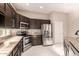 Kitchen with granite countertops, stainless steel appliances, and modern cabinetry at 41638 N Emerald Lake Dr, Anthem, AZ 85086