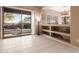 Bright living area with large sliding glass door to outdoor patio and built-in shelving at 41638 N Emerald Lake Dr, Anthem, AZ 85086
