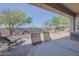 Spacious covered patio with outdoor seating, ideal for enjoying the desert landscape at 41638 N Emerald Lake Dr, Anthem, AZ 85086