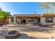 Spacious patio with a gas grill, fire pit, and an outdoor dining area at 41638 N Emerald Lake Dr, Anthem, AZ 85086