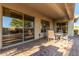 Covered patio with dining table and chairs, offering outdoor living space at 41638 N Emerald Lake Dr, Anthem, AZ 85086