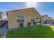 Well-maintained backyard featuring artificial turf, a fire pit, and convenient covered patio area at 4514 W Hazel Ln, San Tan Valley, AZ 85144