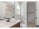 Bright bathroom with modern vanity, walk-in closet, and a tiled shower/tub combination at 4514 W Hazel Ln, San Tan Valley, AZ 85144