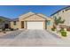 Charming single-story home featuring a well-manicured yard and a two-car garage at 4514 W Hazel Ln, San Tan Valley, AZ 85144