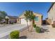 Beige single story home with an attached garage, landscaped front yard and a concrete driveway at 4514 W Hazel Ln, San Tan Valley, AZ 85144
