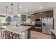 Modern kitchen boasts granite island, stainless appliances, and custom cabinetry at 4514 W Hazel Ln, San Tan Valley, AZ 85144