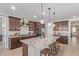 Modern kitchen with large granite island, stainless steel appliances and lots of cabinet space at 4514 W Hazel Ln, San Tan Valley, AZ 85144