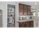 Walk-in pantry featuring custom shelving and ample storage space at 4514 W Hazel Ln, San Tan Valley, AZ 85144