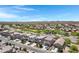 Panoramic aerial view showcasing a community with desert landscaping and distant mountain vistas at 4527 E Gagarinite Ln, San Tan Valley, AZ 85143