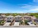 An aerial shot captures a neighborhood featuring well-maintained homes and desert landscaping at 4527 E Gagarinite Ln, San Tan Valley, AZ 85143