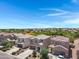 An aerial view highlights a residential neighborhood with mountain views in the distance at 4527 E Gagarinite Ln, San Tan Valley, AZ 85143
