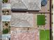 Aerial view of manicured backyards featuring pavers, artificial turf and landscaping at 4527 E Gagarinite Ln, San Tan Valley, AZ 85143