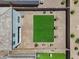 Aerial view of a backyard featuring pavers, artificial turf, landscaping, and privacy fence at 4527 E Gagarinite Ln, San Tan Valley, AZ 85143